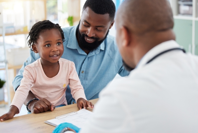 Doctor consulting with black family